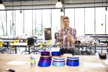 DXARTS' McMahon FabLab manager Derrick Van Kirk showing some 3d printed face masks (Dennis Wise/UW)