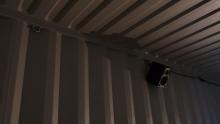 Speaker in a shipping container