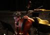 Cellist Jay Campbell of JACK Quartet checks sheet music during a rehearsal break at the “brain-art initiative” at Meany Studio Theater. (Alan Berner/The Seattle Times)