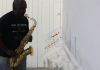 Warren Neidich playing the saxaphone