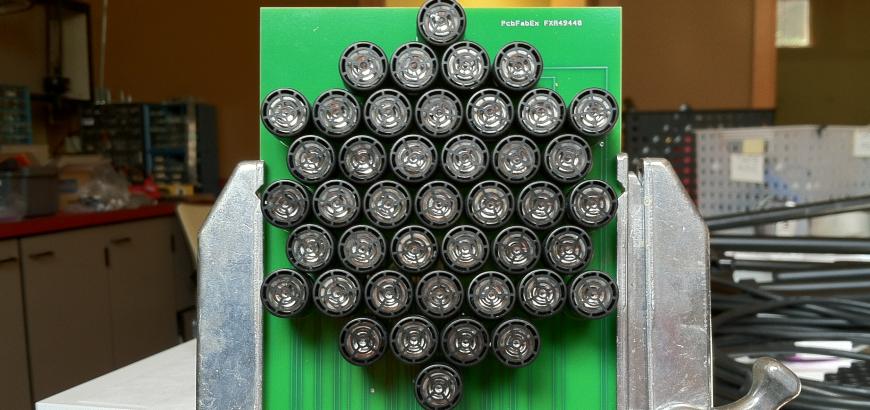 A prototype of a 2-D steering ultrasonic speaker array.