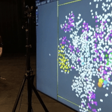Performer Derek Crescenti activating certain sonic clusters according to the trajectory scored on the floor of the stage.